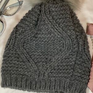Grey croché Beanie with a pom pom and fits all